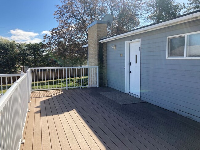 Photo - Spacious 4-Bedroom, 2-Bath Home with Daylight Basement, Large Yard & Two Fireplaces!.