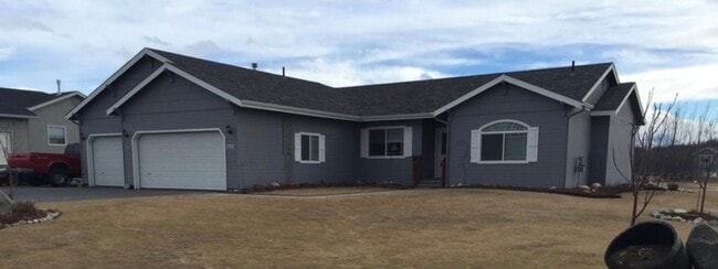 Building Photo - Ranch style 3 bedrooms with an office Plus a 3 car garage and large back yard complete with green...