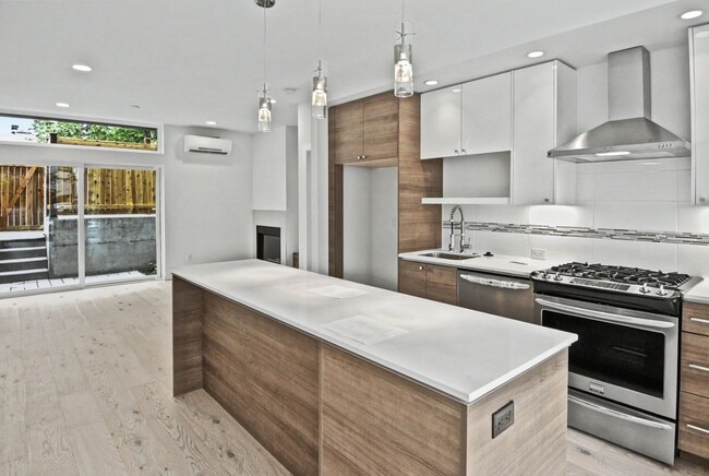 Photo - AVAILABLE AUGUST 14th! Modern Townhome w/ Private Balcony, AC, & Reserved Parking in Central Area