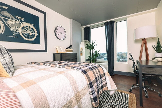 Experience urban living with elegance in this tastefully designed bedroom, perfect for relaxation and productivity.