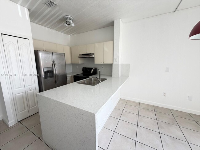 Building Photo - 7080 NW 177th St Unit 209-13