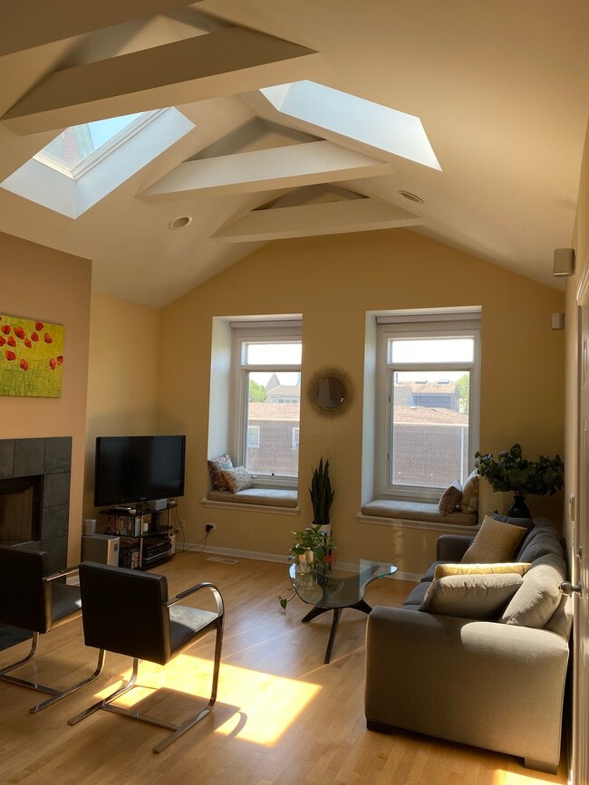 Living room -- wired for surround sound, speaker system & window seat cushions come with the unit - 3111 N Seminary Ave Unit 3S