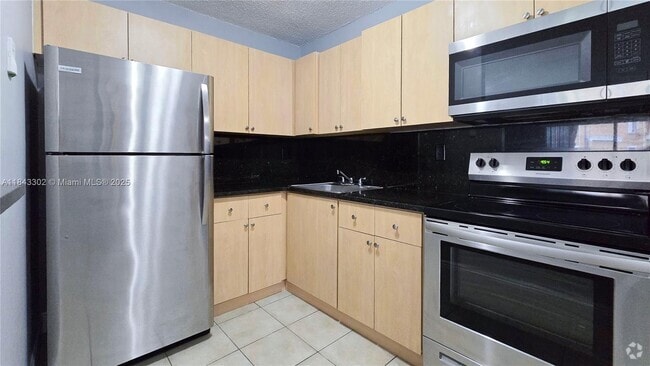 Building Photo - 7210 NW 179th St Unit 106 Rental