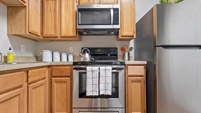 Unleash your inner chef in this fully-appointed kitchen. A symphony of appliances awaits your culinary masterpiece. - Greystone Woods