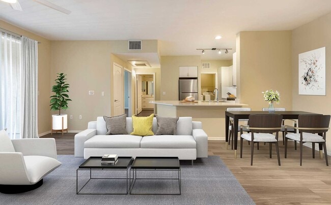 Renovated Package I kitchen, living, and dining areas with hard surface flooring