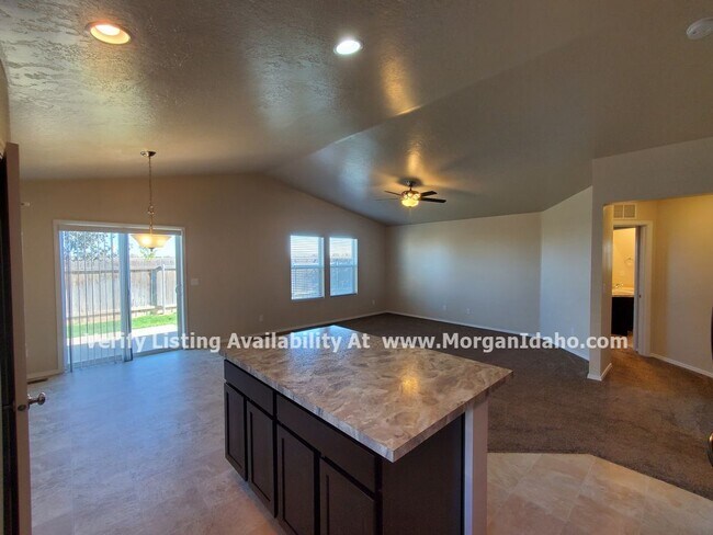 Photo - Office, vaulted ceilings, 2-car garage and...