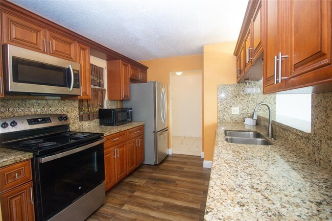 Building Photo - 3100 N Pine Island Rd Unit 207 Rental