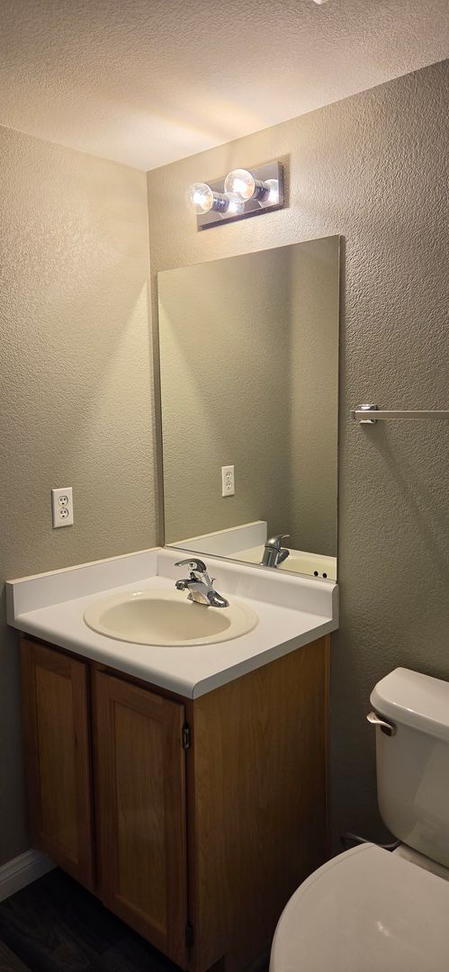 Photo - Two story 2 bedroom townhome with newer flooring, paint & appliances - community pool!