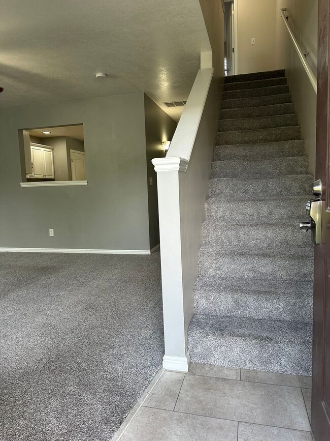 Photo - 2-Bedroom Townhome with Central AC and Covered Parking