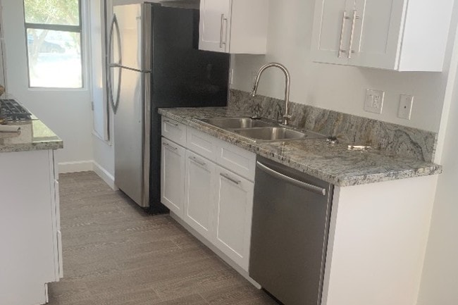 Kitchen with White Shaker Cabinets - 73530 Catalina Way Apartments Unit info@twelve14.com