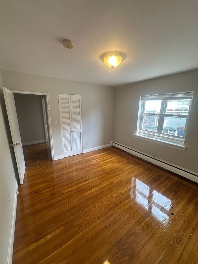 Building Photo - No Fee!  Huge and Sunny Apt near Cleveland Circle and T's! Heat and Hot Water Included! Cat Frien...