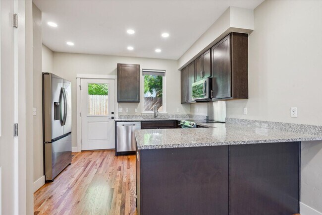 Photo - Modern 4-Bedroom Townhome with Rooftop Deck Near Sloan’s Lake & Light Rail