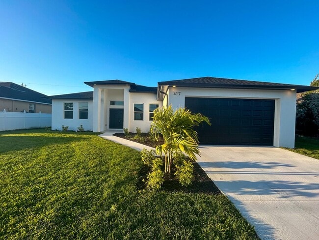 Building Photo - Stunning New Construction Home in Desirable Cape Coral Neighborhood - Modern Design, Spacious Lay...