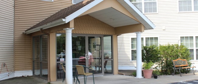 Main entrance parking lot - Cornerstone Senior Apartments Apartments