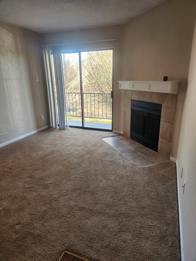 Living Room w/ Wood Burning Fireplace