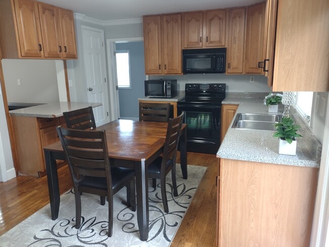 Beautiful Kitchen which includes stove, fridge, & microwave - 1208 E Main St