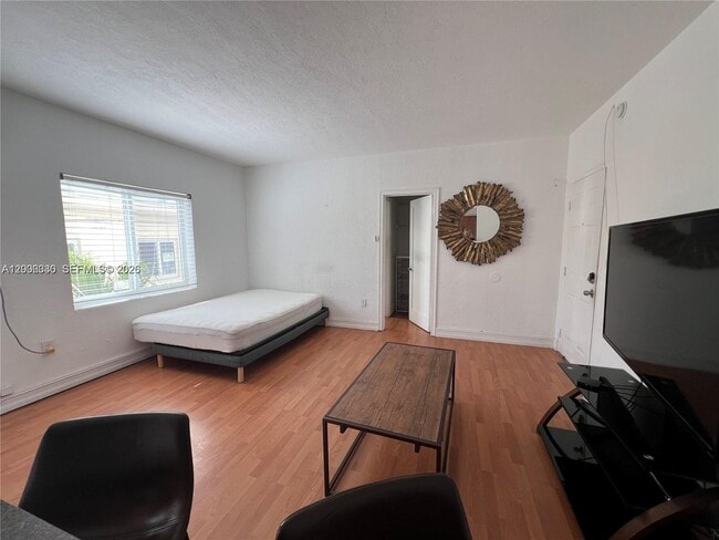 Building Photo - 7920 Harding Ave Unit 9