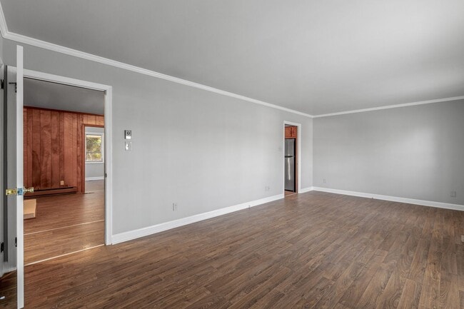 Photo - Large Brick Ranch, New Wood Like Flooring Throughout, Just Painted, LR, Den, Sun Room, Carport!