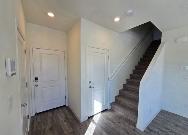 Photo - Modern 3-Bedroom Townhome with 2-Car Garage, Bright Interiors & Private Patio