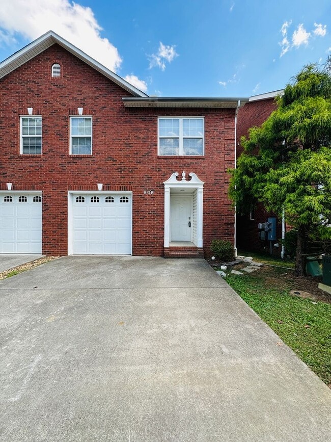 Building Photo - 2 bed, 2.5 bath updated townhouse w/ 1-car garage & Trex deck available now