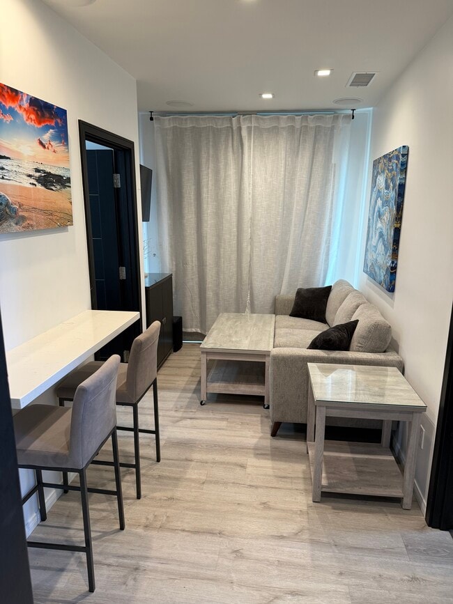 Living Room, coffee table has wheels to move around easily - 3426 Gurnard Ave Unit 3424