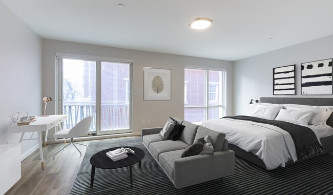 Spacious studio apartments with large windows for natural light