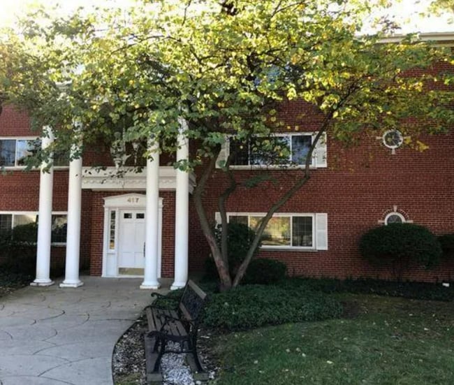 Brick, low-rise building on quiet street