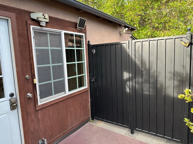 Gate leading to back yard - 10809 Huston St