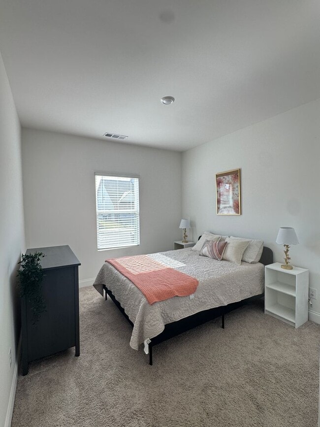 Photo - Fully Furnished 4BR Home with Loft, Patio & 2-Car Garage – Lawn Care Included