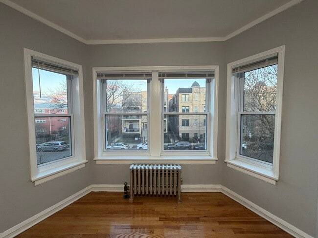 Building Photo - 6950 N Ashland Blvd Unit 301