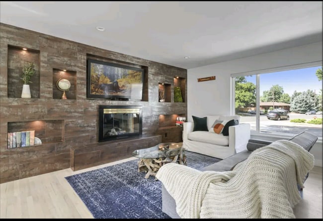 Living room with Samsung Frame TV - 5245 E Iliff Ave