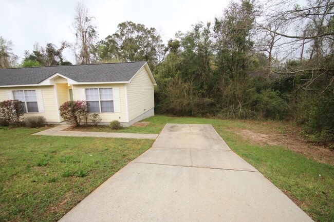 Photo - 3BR/2BA Home Near UWF – Wood-Look Flooring, Galley Kitchen, Pet Friendly!
