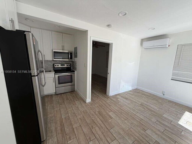 Building Photo - 5843 Harding St Unit 1-2