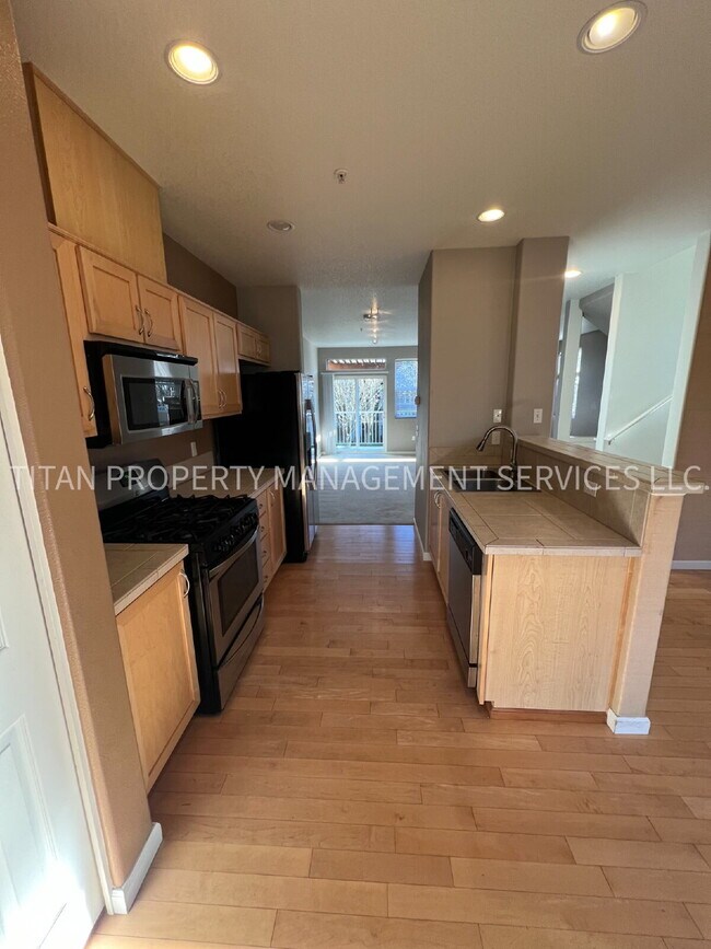 Photo - Beautiful Three Story Townhouse with Gas Fireplace, Balcony & 2-Car Garage Unit 101