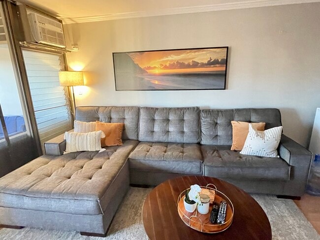 Furnished living room with chaise couch. - 1521 Alexander St Unit 406