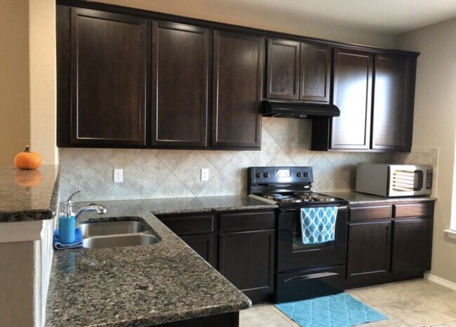 Photo - "Spacious 4-Bedroom Retreat with Granite Countertops & Private Movie Room in Selma, TX!"
