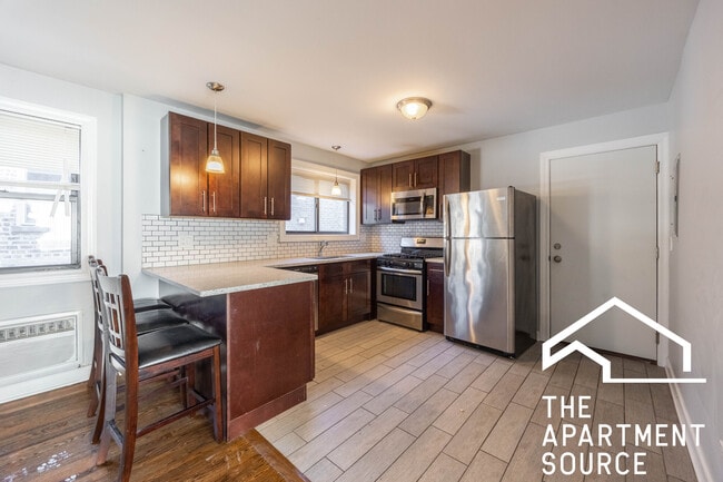 Building Photo - 6807 N Ridge Blvd Unit 101