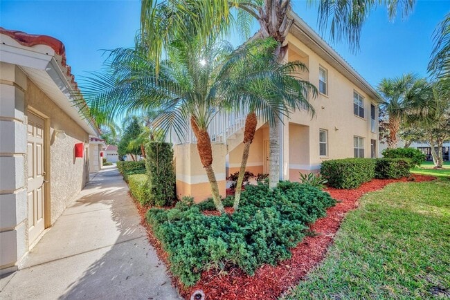 Building Photo - Elegant 3 Bedroom End-Unit Condo with Screened Lanai & Pond Views and A Private Garage