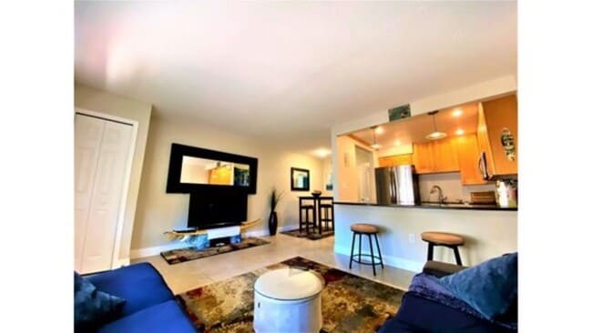 Living Room with Large Flatscreen and Surround Sound - 7801 Ridgewood Ave Unit ModernBeachPad