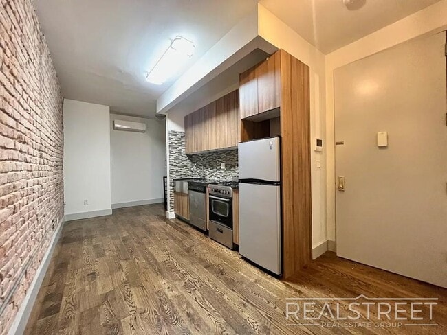 Photo - True 4 Bedroom layout — no flex, no railroad - Massive full-floor basement with second private entra Unit 1L