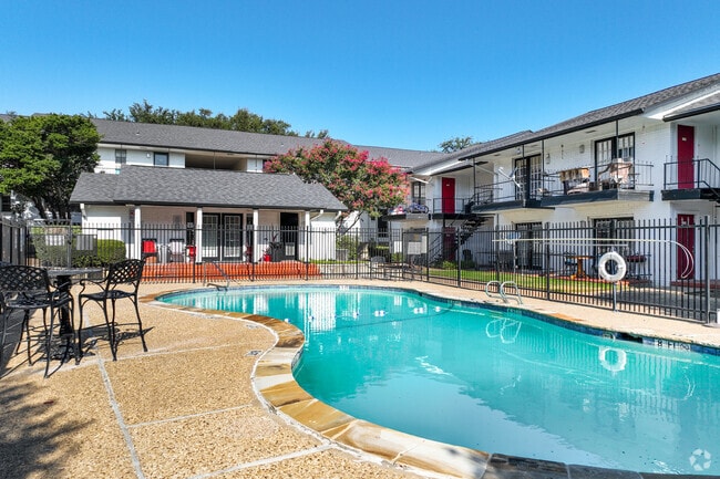 Resort-style pool with lounge seating, perfect for relaxing under the sun. - Renaissance Gardens Rental