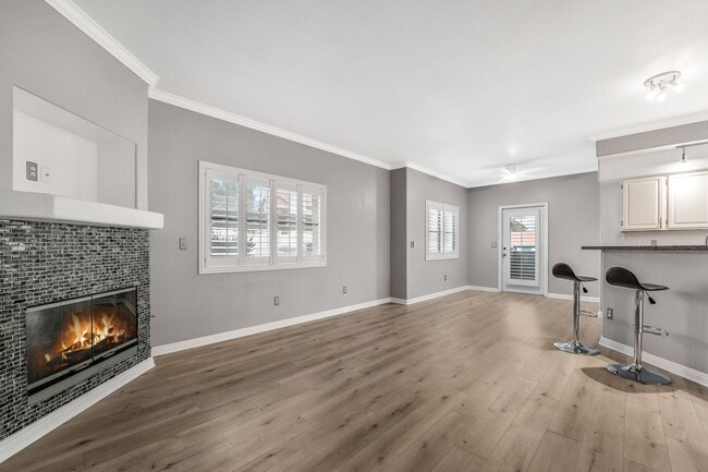 Photo - Light-Filled Dual-Suite Condo with Soaring Ceilings, Fireplace & Private Balcony in Amenity-Rich ...