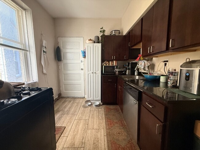Photo - Rogers Park 2 Bed 1 Bath With Central AC & Heat, Beautiful Sunroom, Dog Friendly, Available July ... Unit 2