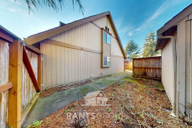 Photo - Lovely pet-free end unit in an established...