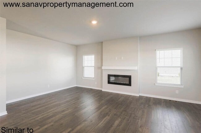 Photo - "Stylish 4-Bedroom Home in Prairie Trail with Modern Amenities"