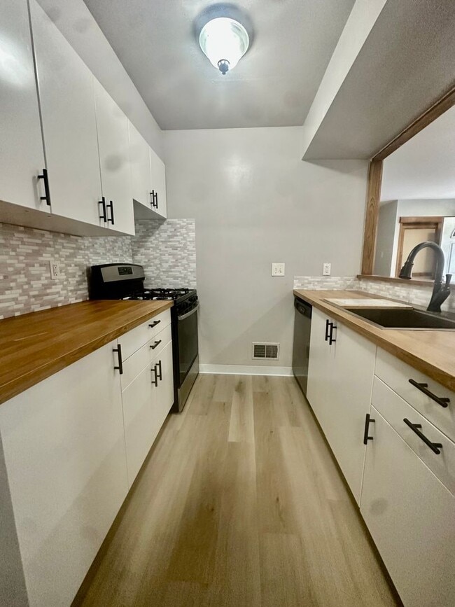 Photo - Open-Concept 3BR Condo with Finished Basement in Canton