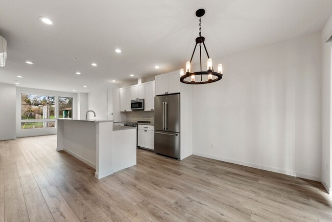 Photo - Modern 3 Bed 3.5 Bath Townhome with Garage, Balcony and Fenced Yard Near Light Rail