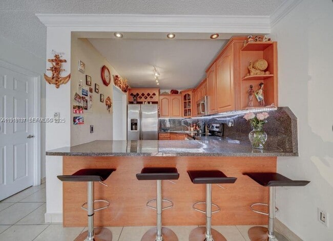 Building Photo - 6950 W 6th Ave Unit 416