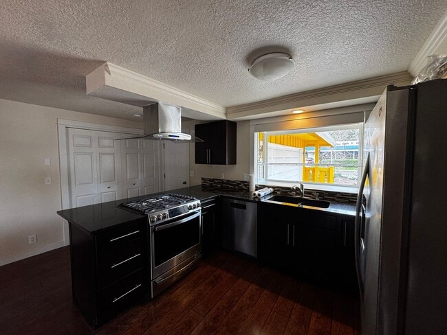 Photo - Charming 3 Bedroom Home with Beautiful Backyard & RV Parking