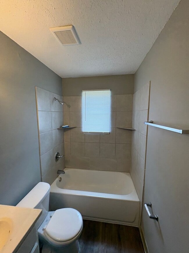 Photo - This 2BR/1BA includes a nice-sized living area, an ample kitchen, a fenced-in